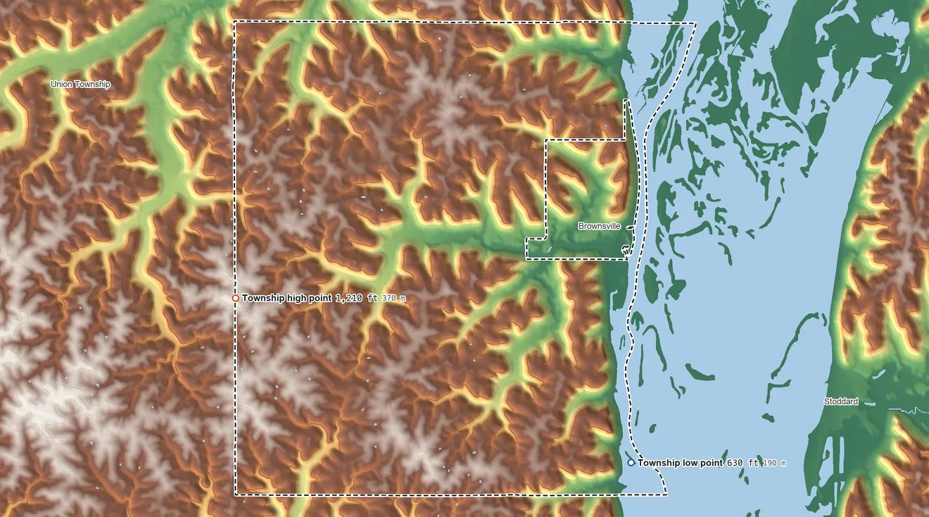 Topographic elevation map of Brownsville Township, Minnesota, shaded from 630 ft on the southeast side to 1,210 ft on the west side