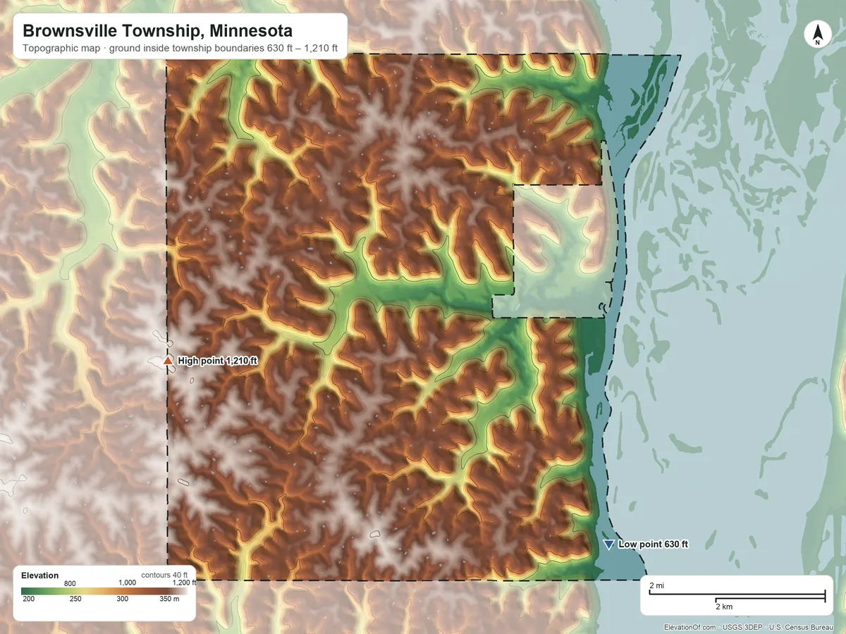 Topographic elevation map of Brownsville Township, Minnesota, shaded from 630 ft on the southeast side to 1,210 ft on the west side