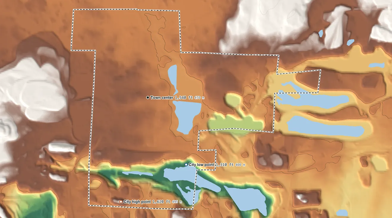 Topographic elevation map of Chisholm, Minnesota, shaded from 1,310 ft on the southeast side to 1,620 ft on the south side