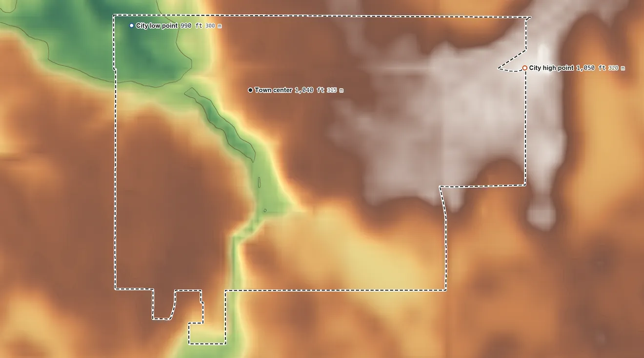 Topographic elevation map of Cleveland, Minnesota, shaded from 990 ft on the northwest side to 1,050 ft on the east side