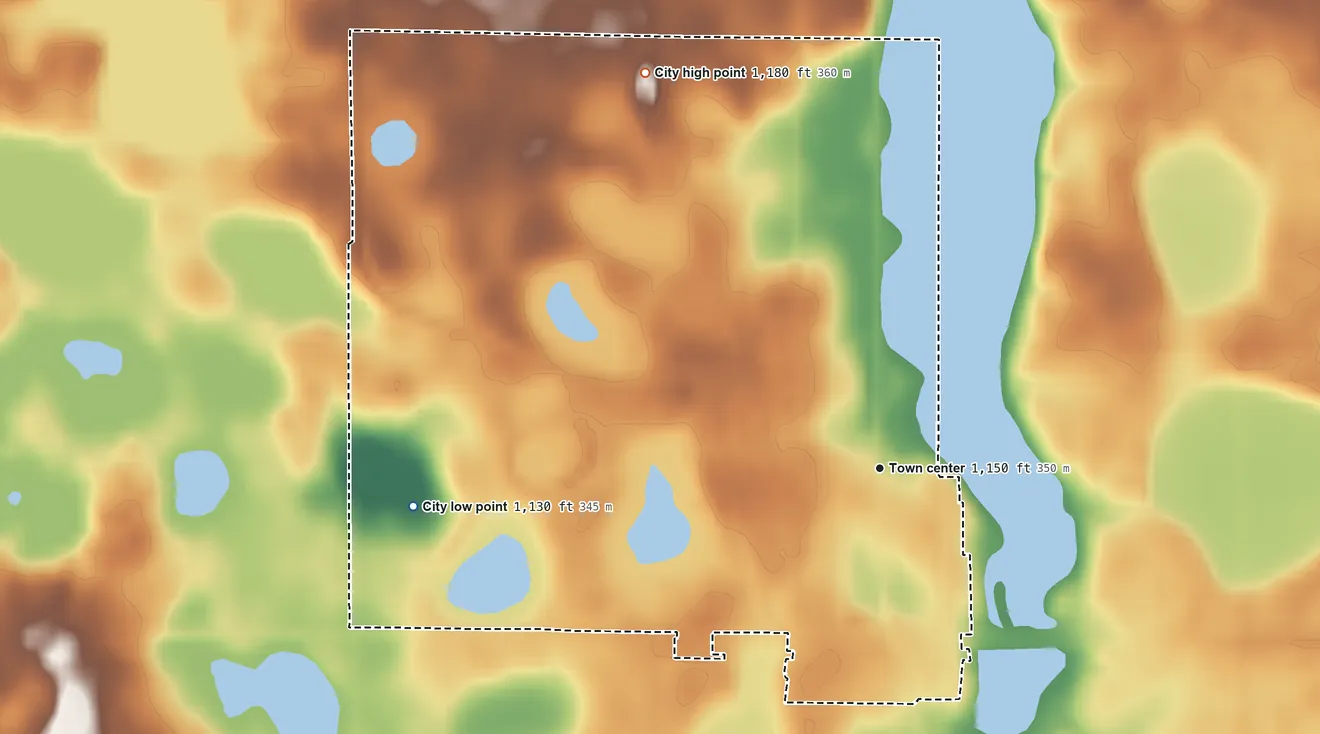 Topographic elevation map of Clinton, Minnesota, shaded from 1,130 ft on the west side to 1,180 ft on the northwest side