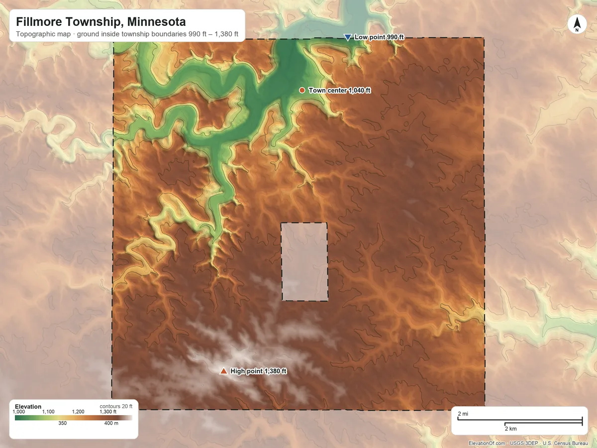 Topographic elevation map of Fillmore Township, Minnesota, shaded from 990 ft on the northeast side to 1,380 ft on the south side