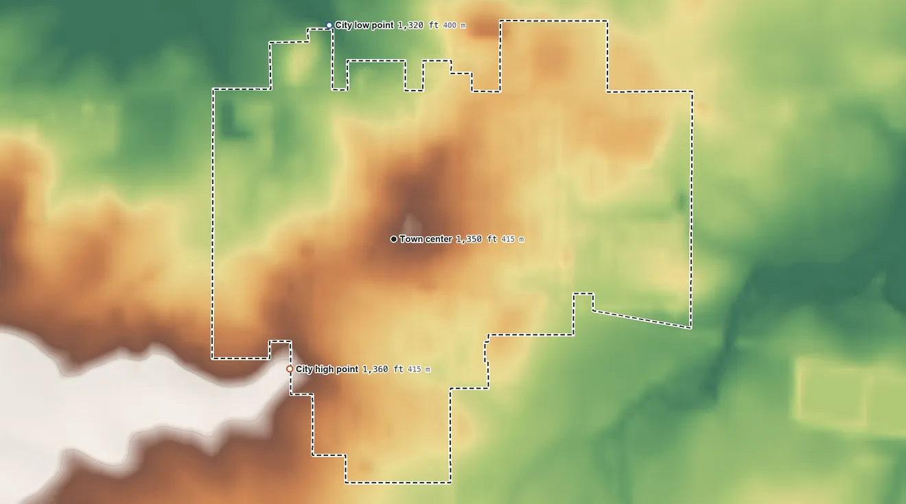 Topographic elevation map of Grand Meadow, Minnesota, shaded from 1,320 ft on the north side to 1,360 ft on the southwest side