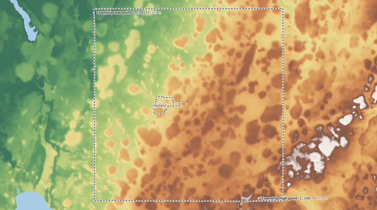 Topographic elevation map of Hartland Township, Minnesota, shaded from 1,190 ft on the northwest side to 1,340 ft on the southeast side