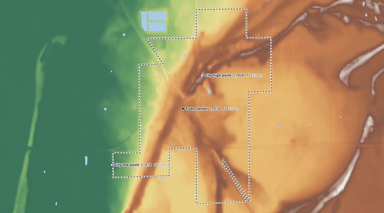 Topographic elevation map of Karlstad, Minnesota, shaded from 1,030 ft on the southwest side to 1,060 ft on the northeast side