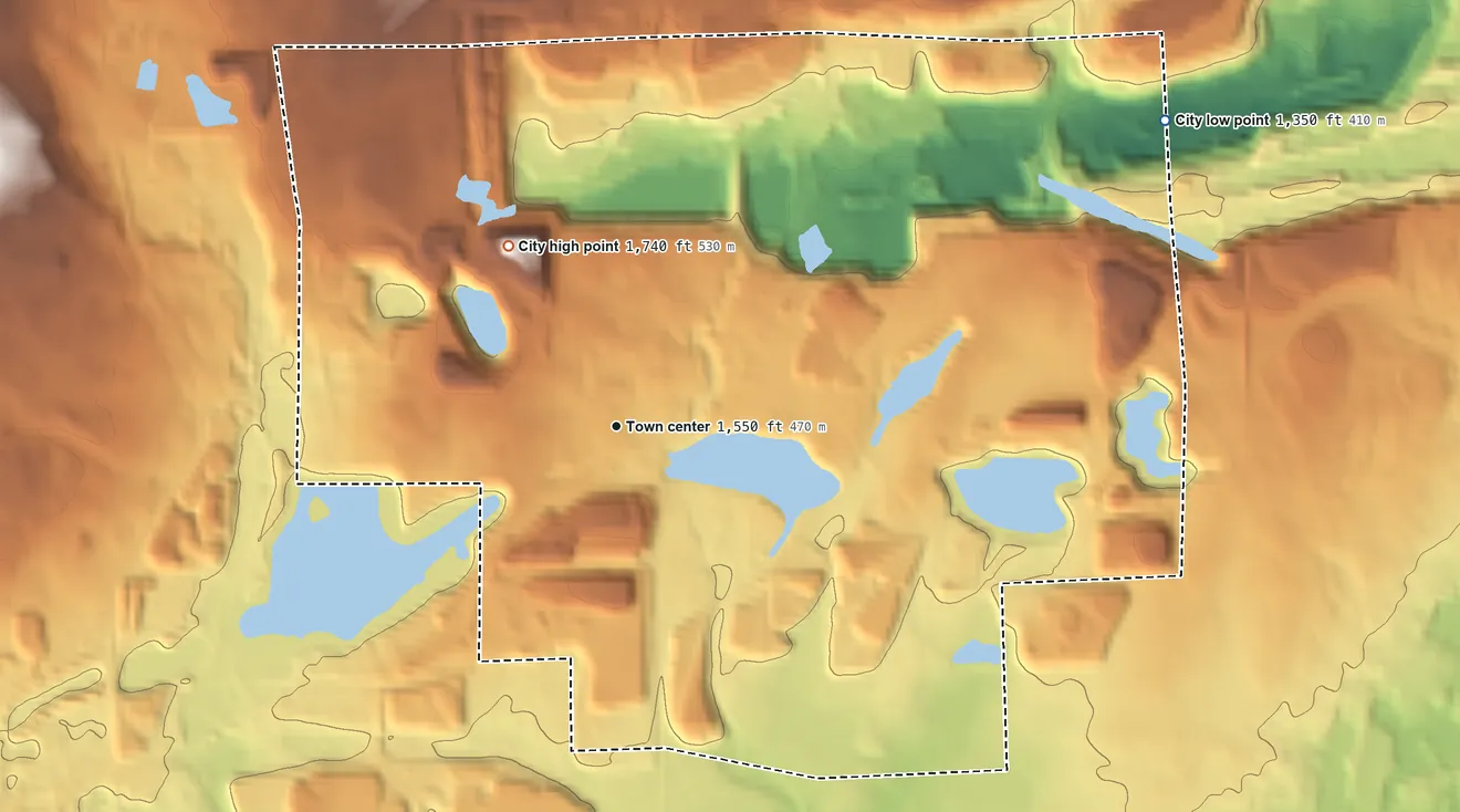 Topographic elevation map of Kinney, Minnesota, shaded from 1,350 ft on the northeast side to 1,740 ft on the northwest side