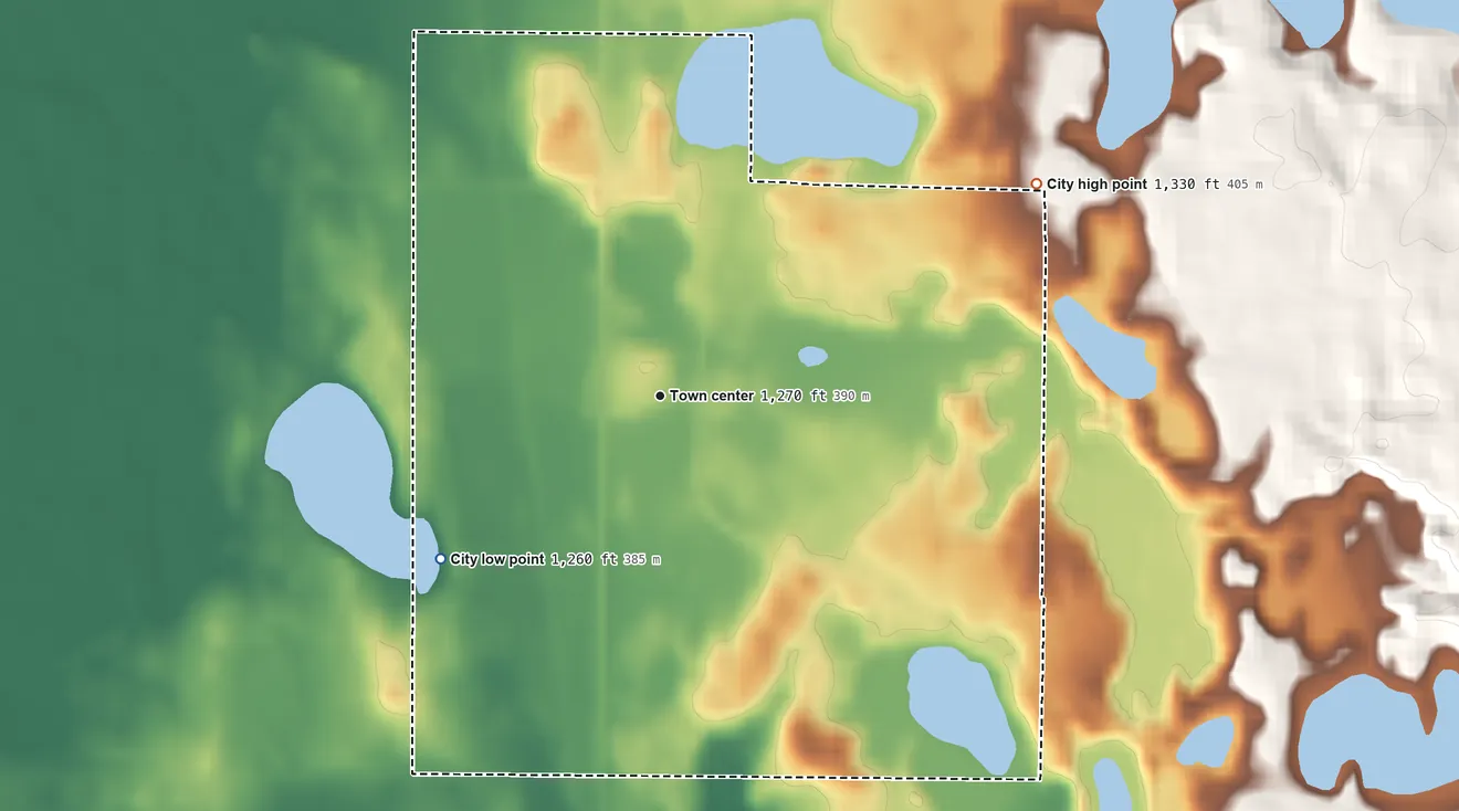 Topographic elevation map of Ogema, Minnesota, shaded from 1,260 ft on the southwest side to 1,330 ft on the northeast side