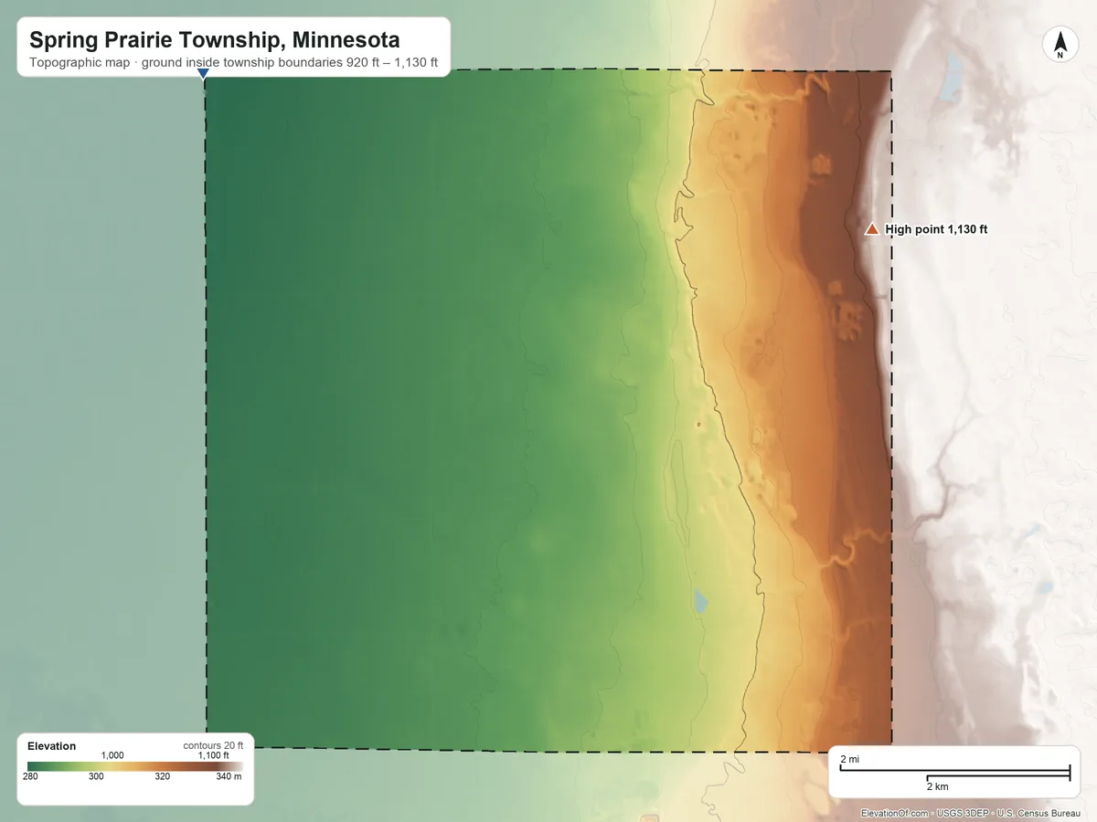 Topographic elevation map of Spring Prairie Township, Minnesota, shaded from 920 ft on the northwest side to 1,130 ft on the northeast side