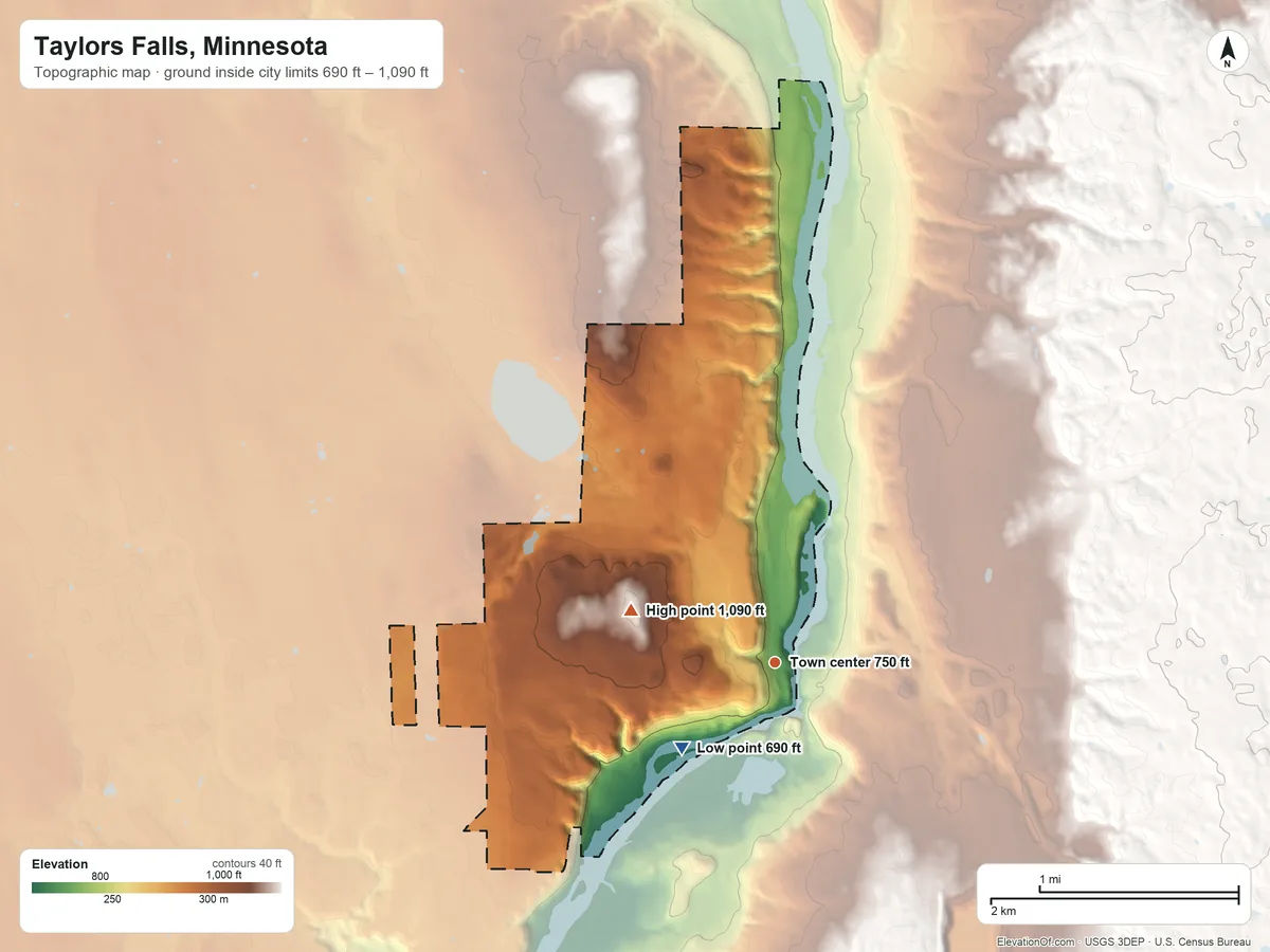 Topographic elevation map of Taylors Falls, Minnesota, shaded from 690 ft on the southwest side to 1,090 ft on the west side