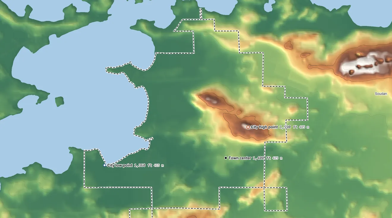 Topographic elevation map of Tower, Minnesota, shaded from 1,360 ft on the west side to 1,590 ft on the northeast side