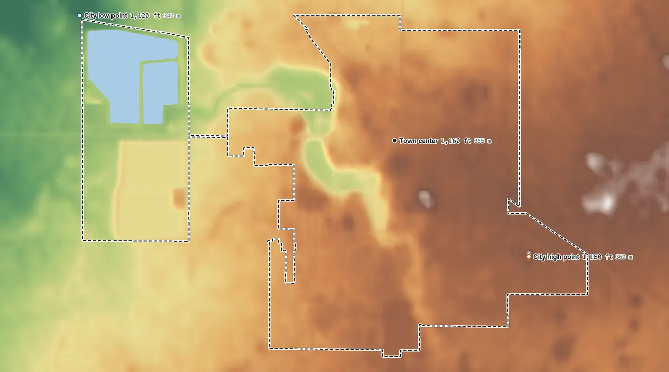 Topographic elevation map of Wells, Minnesota, shaded from 1,120 ft on the west side to 1,180 ft on the southeast side