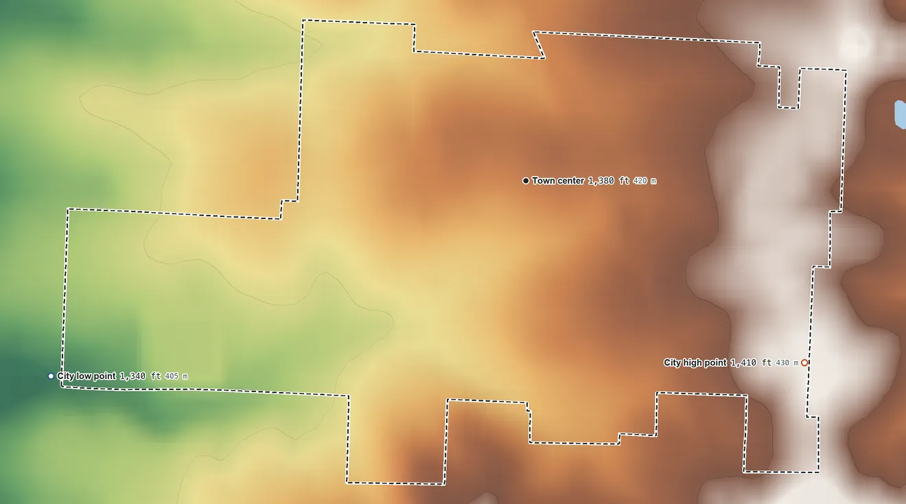 Topographic elevation map of Wheaton, Missouri, shaded from 1,340 ft on the west side to 1,410 ft on the southeast side