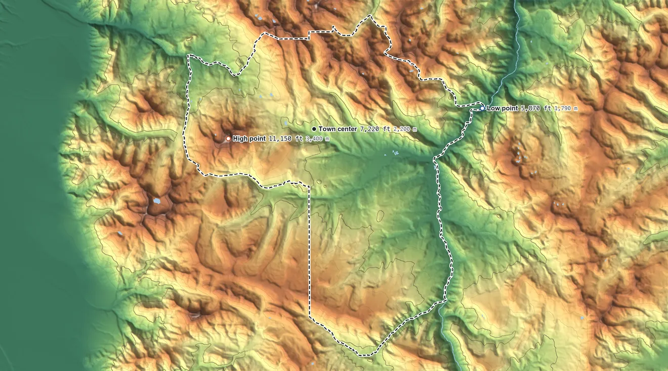 Topographic elevation map of Big Sky, Montana, shaded from 5,870 ft on the east side to 11,150 ft on Lone Mountain