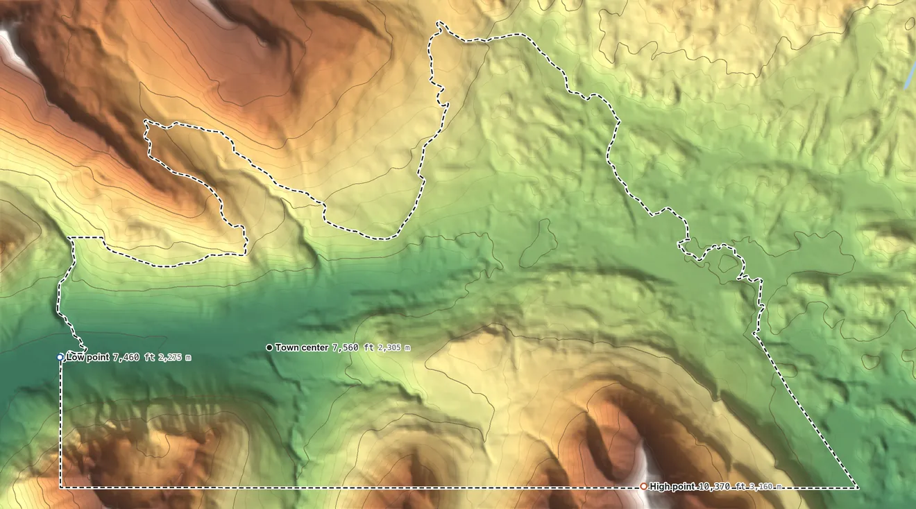 Topographic elevation map of Cooke City, Montana, shaded from 7,460 ft on the west side to 10,370 ft at the foot of the Beartooth Mountains