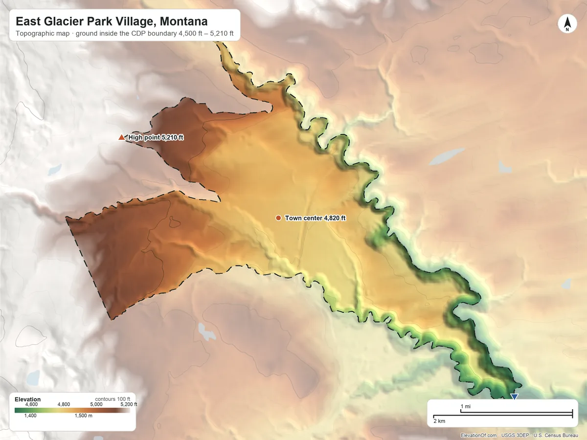 Topographic elevation map of East Glacier Park Village, Montana, shaded from 4,500 ft on the southeast side to 5,210 ft on the northwest edge, below higher ground just outside