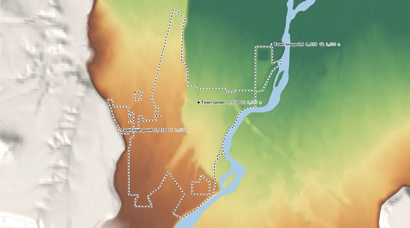 Topographic elevation map of Ennis, Montana, shaded from 4,920 ft on the northeast side to 5,010 ft at the foot of the Madison Range