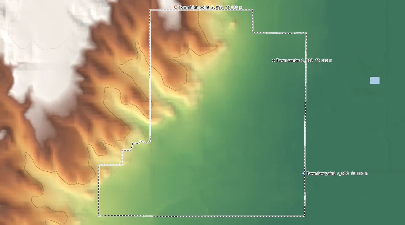 Topographic elevation map of Fairview, Montana, shaded from 1,900 ft on the south side to 2,090 ft on the northwest side