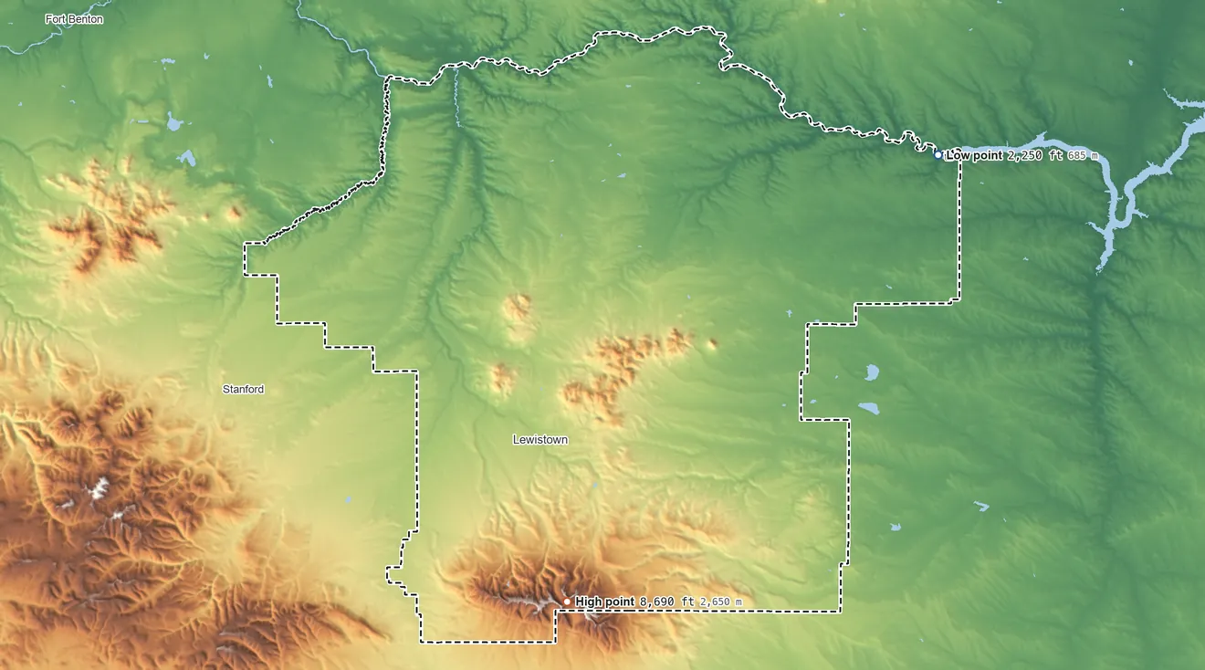 Topographic elevation map of Fergus County, Montana, shaded from 2,250 ft on the northeast side to 8,690 ft on Greathouse Peak