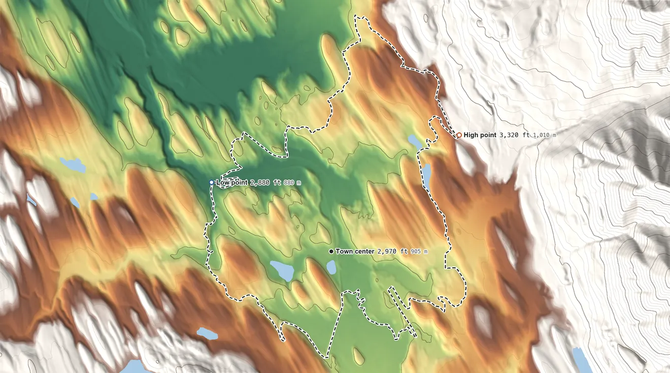 Topographic elevation map of Fortine, Montana, shaded from 2,880 ft on the northwest side to 3,320 ft at the foot of the Whitefish Range