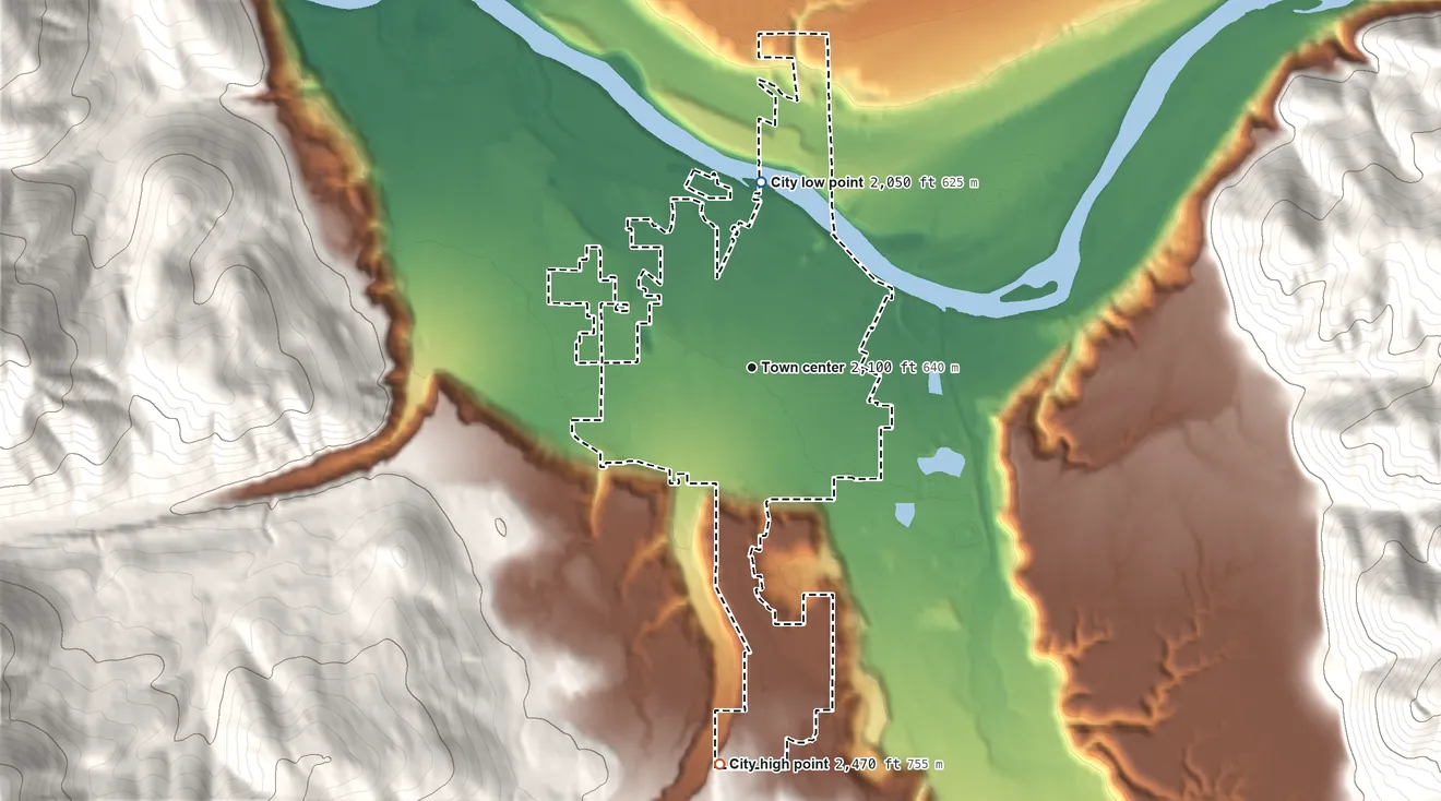Topographic elevation map of Libby, Montana, shaded from 2,050 ft on the north side to 2,470 ft at the foot of the Cabinet Mountains