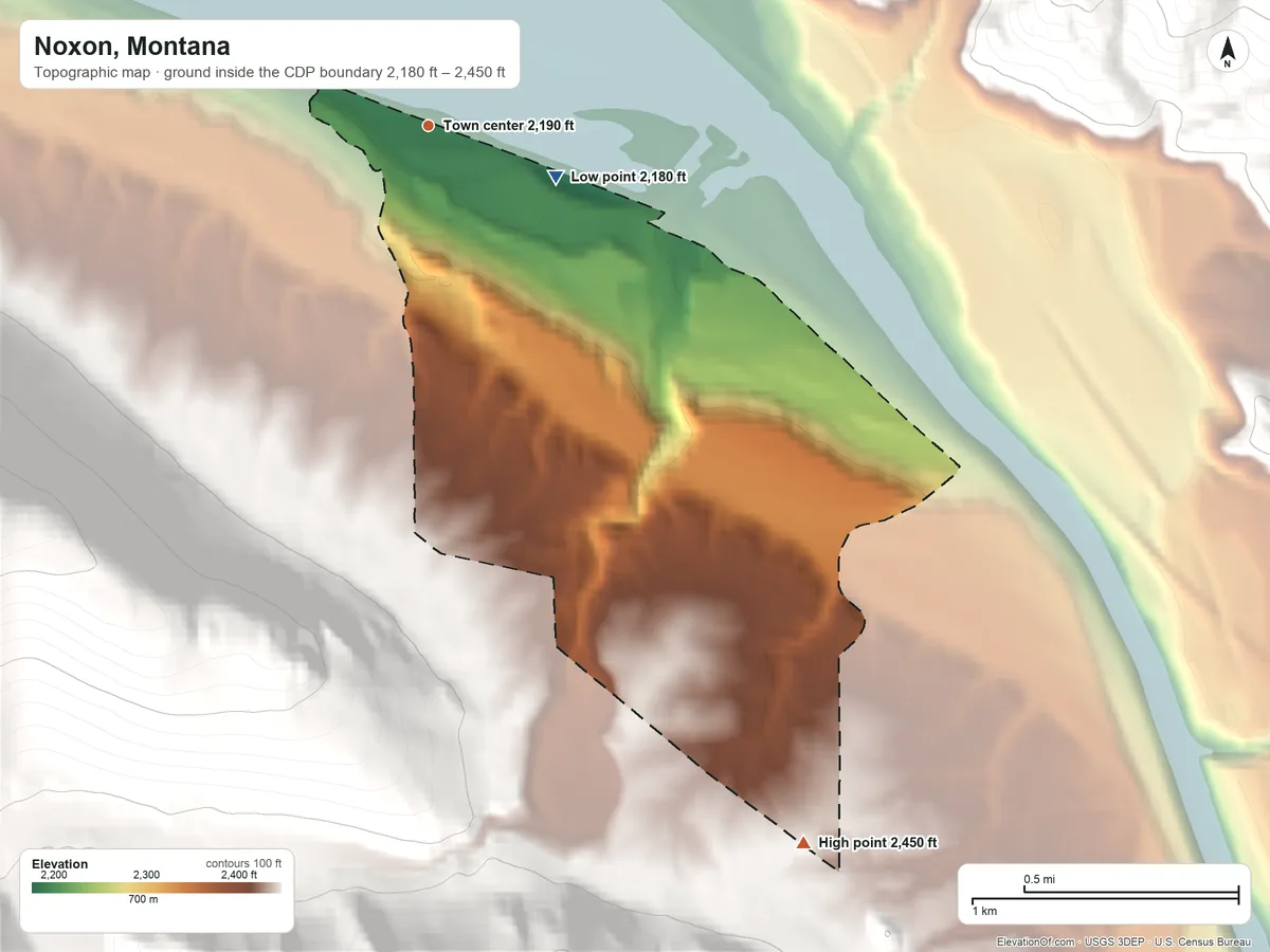 Topographic elevation map of Noxon, Montana, shaded from 2,180 ft on the east side to 2,450 ft on the southeast edge, below higher ground just outside