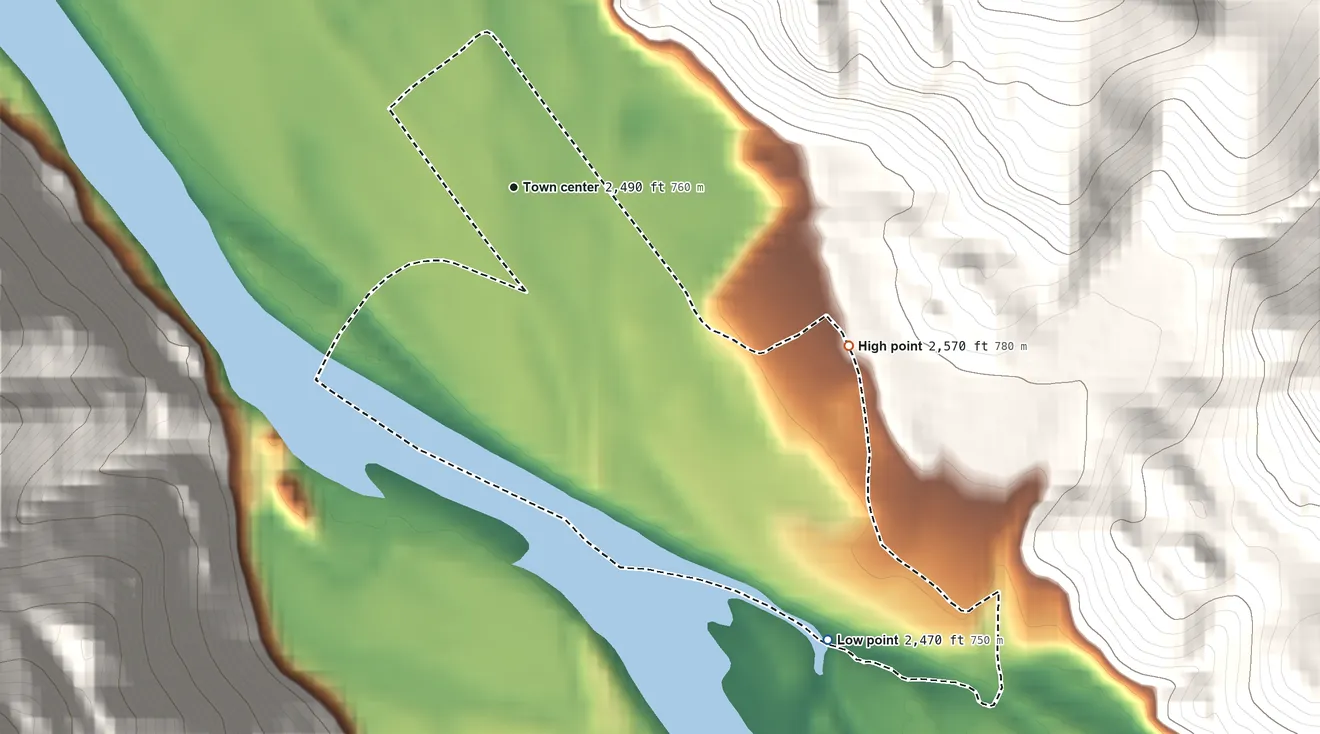 Topographic elevation map of Paradise, Montana, shaded from 2,470 ft on the southeast side to 2,570 ft on the southeast edge, below higher ground just outside