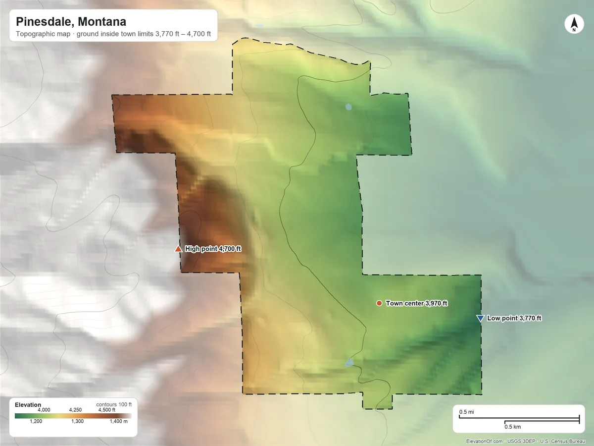 Topographic elevation map of Pinesdale, Montana, shaded from 3,770 ft on the east side to 4,700 ft on the west edge, below higher ground just outside