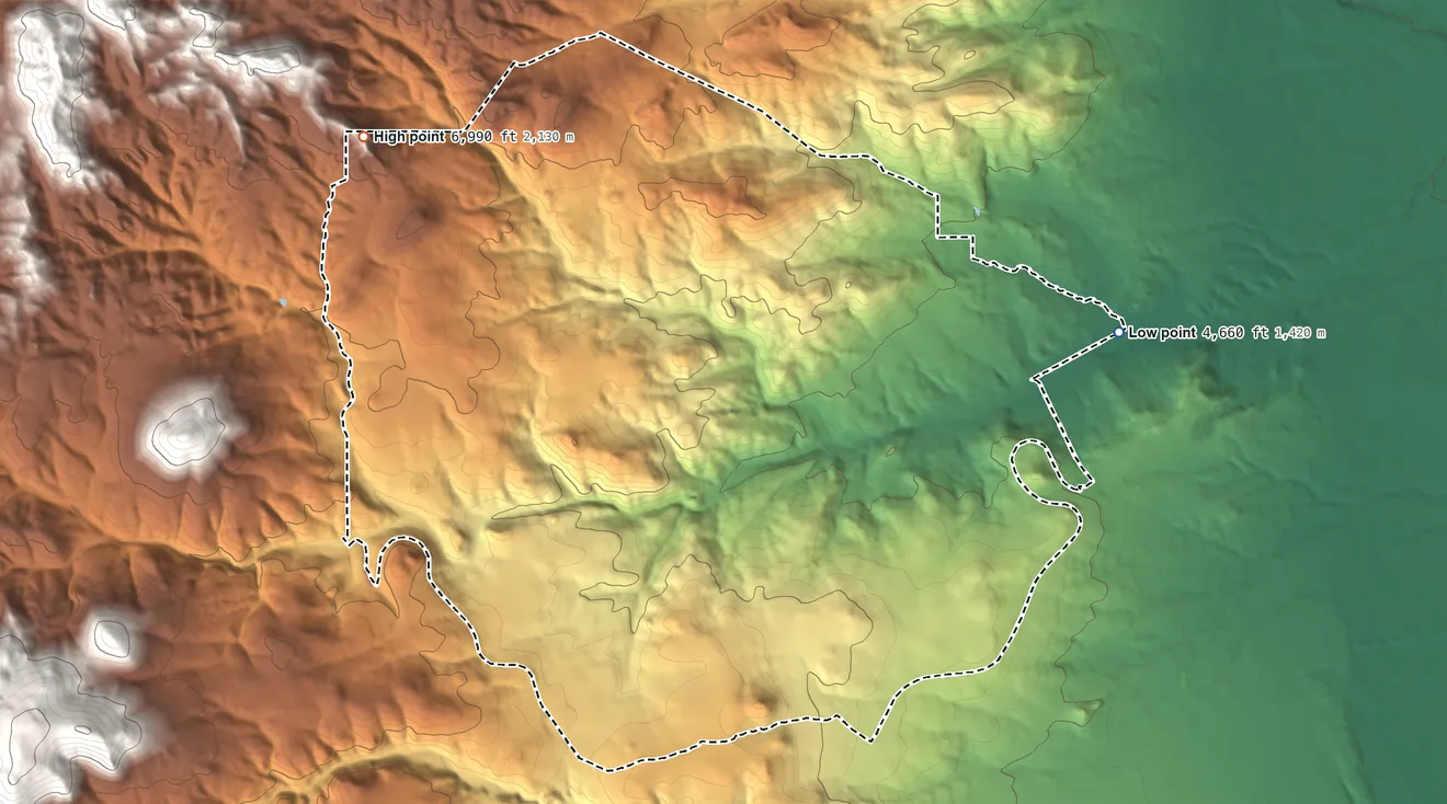 Topographic elevation map of Rader Creek, Montana, shaded from 4,660 ft on the east side to 6,990 ft on the northwest side