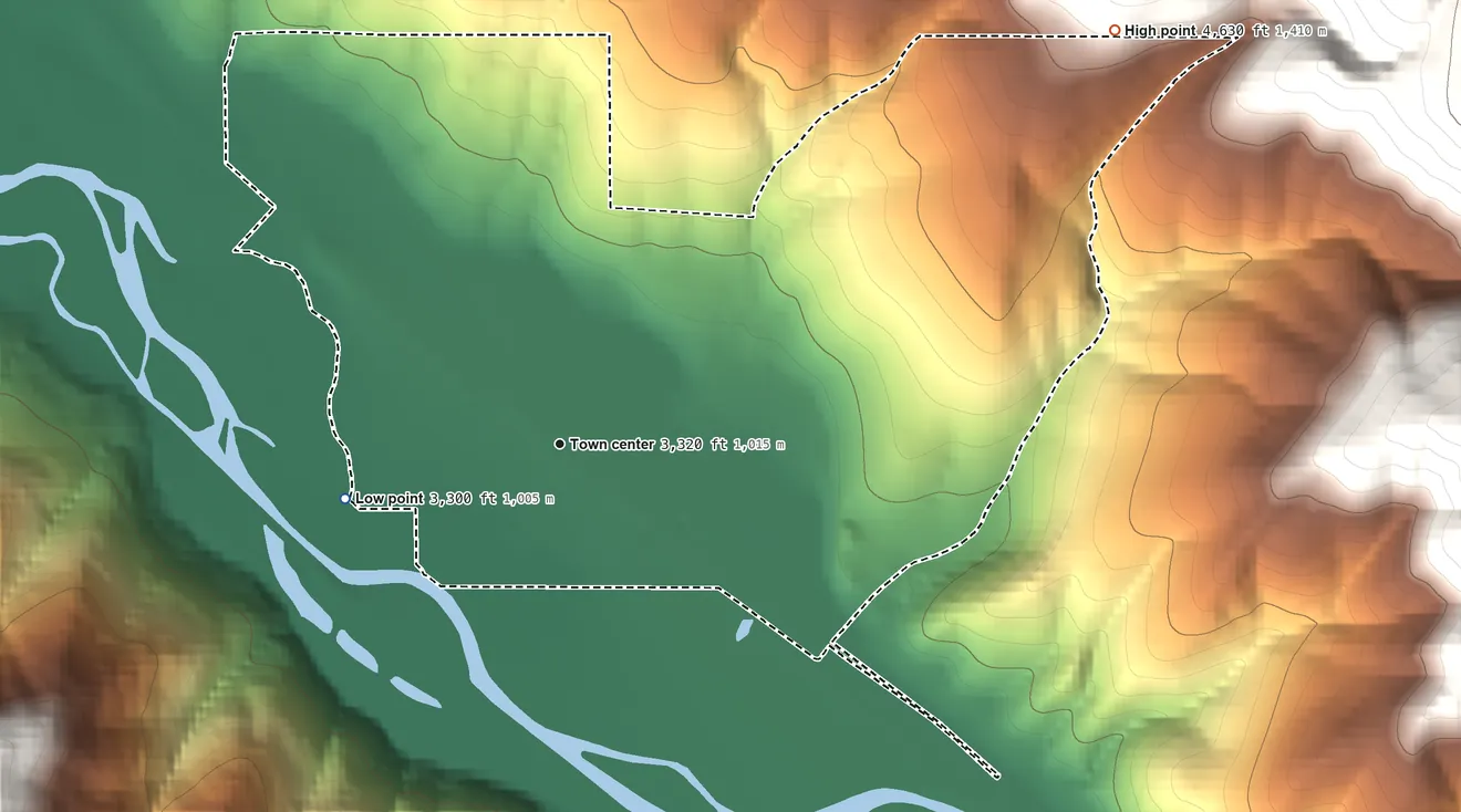 Topographic elevation map of Turah, Montana, shaded from 3,300 ft on the west side to 4,630 ft at the foot of the South Hills