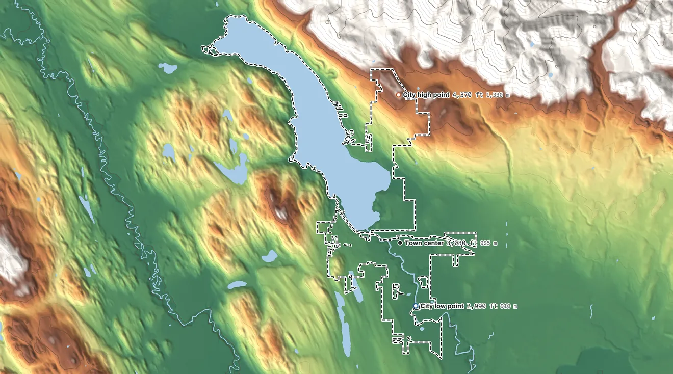 Topographic elevation map of Whitefish, Montana, shaded from 2,990 ft on the south side to 4,370 ft at the foot of the Smoky Range