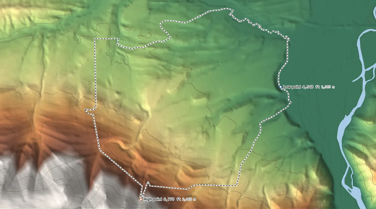 Topographic elevation map of Wineglass, Montana, shaded from 4,540 ft on the east side to 6,770 ft on the southwest edge, below higher ground just outside