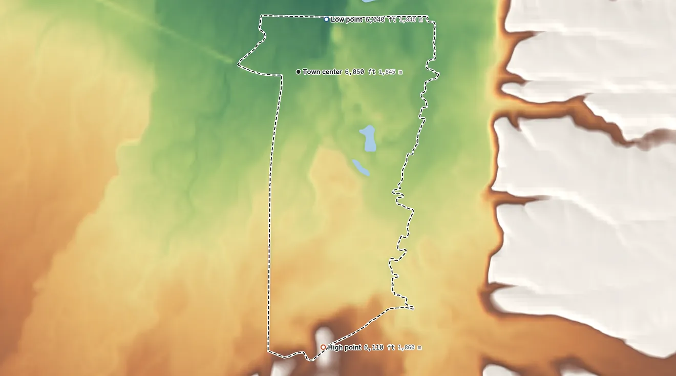 Topographic elevation map of Wisdom, Montana, shaded from 6,040 ft on the northeast side to 6,110 ft on the south side