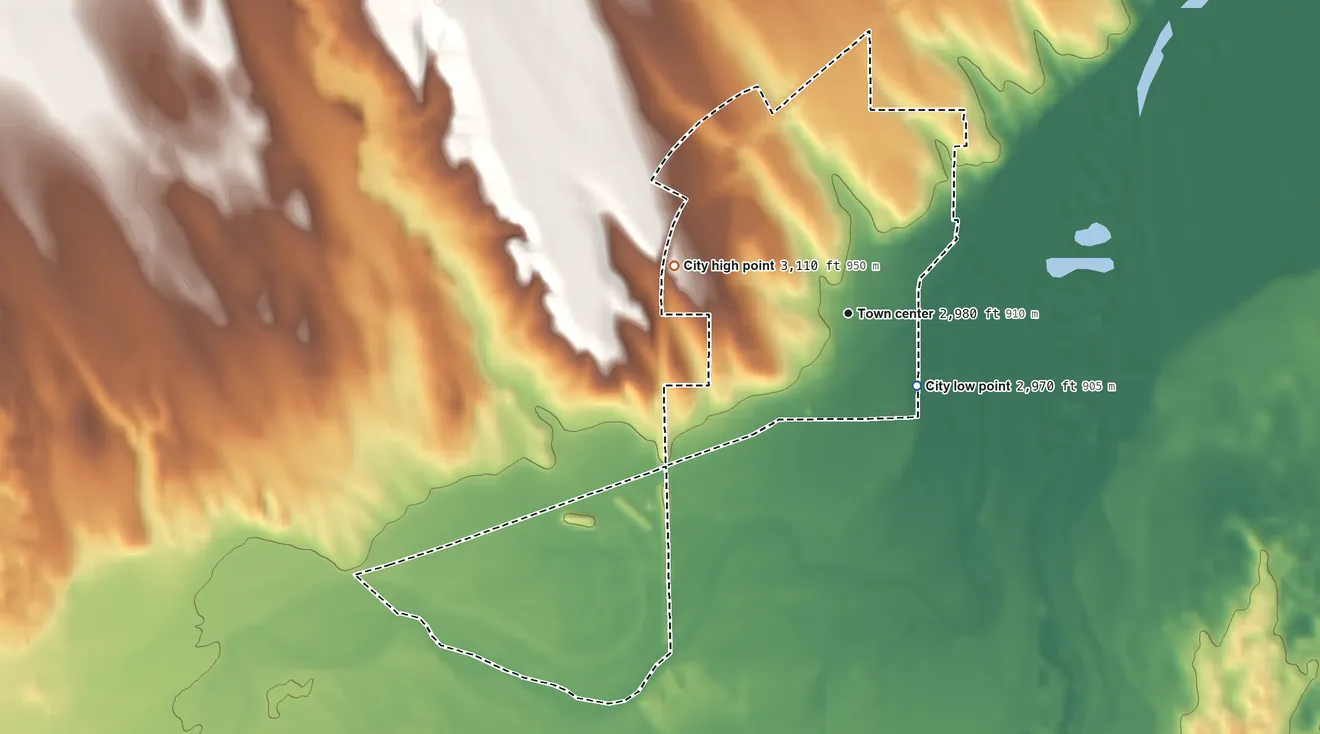 Topographic elevation map of Benkelman, Nebraska, shaded from 2,970 ft on the southeast side to 3,110 ft on the west side
