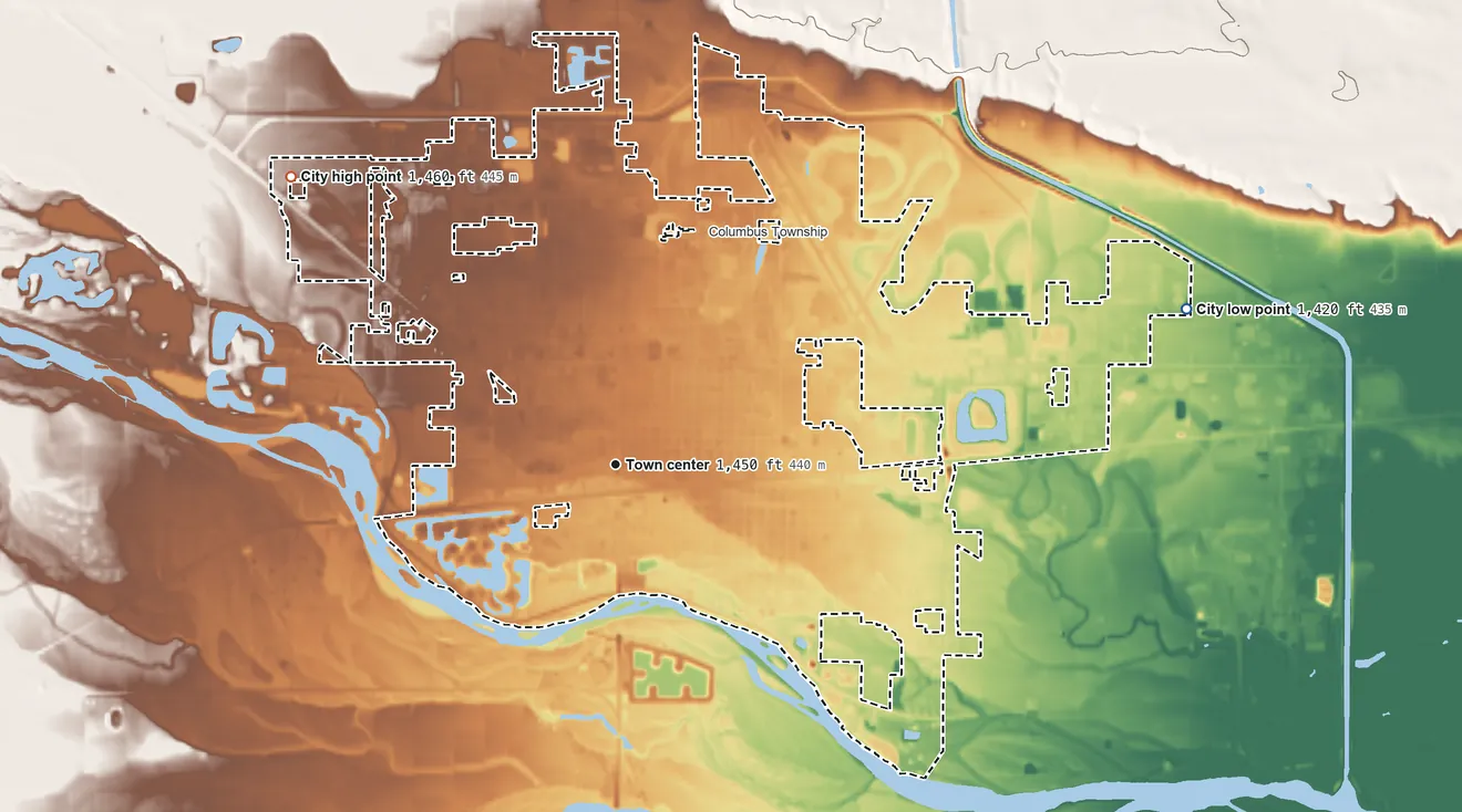 Topographic elevation map of Columbus, Nebraska, shaded from 1,420 ft on the east side to 1,460 ft on the northwest side