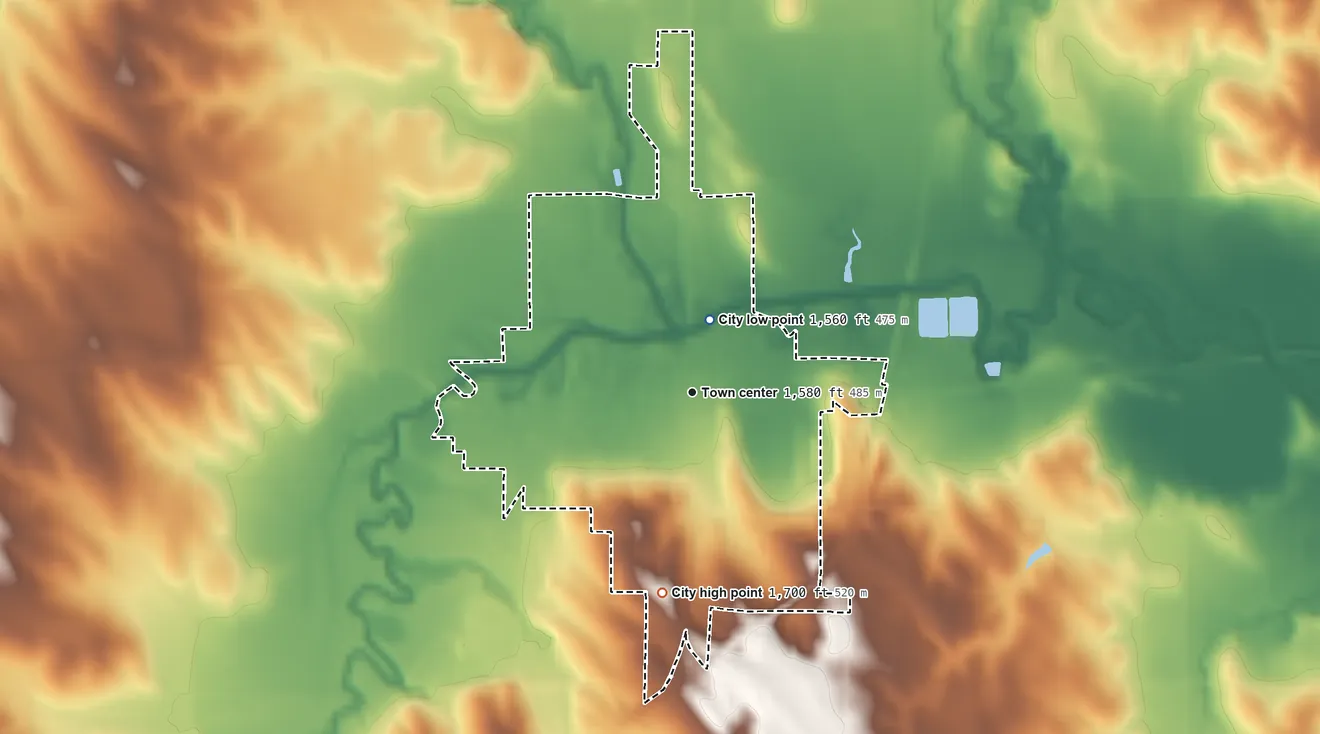 Topographic elevation map of Madison, Nebraska, shaded from 1,560 ft near the middle to 1,700 ft on the south side