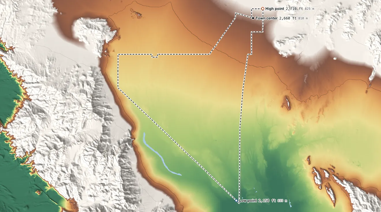 Topographic elevation map of Amargosa Valley, Nevada, shaded from 2,150 ft on the south side to 2,710 ft at the foot of the Striped Hills