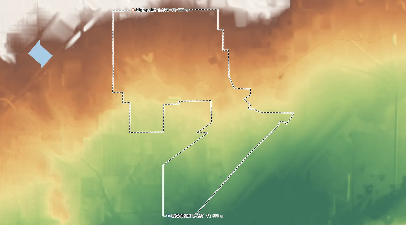 Topographic elevation map of Nellis AFB, Nevada, shaded from 1,830 ft on the south side to 1,970 ft on the north side