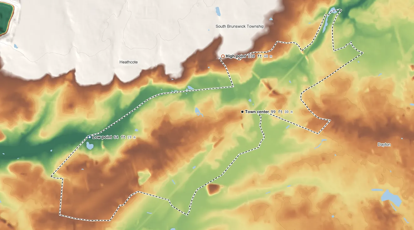 Topographic elevation map of Monmouth Junction, New Jersey, shaded from 64 ft on the west side to 130 ft on the north side
