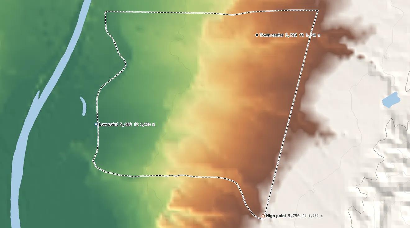Topographic elevation map of Alcalde, New Mexico, shaded from 5,660 ft on the southwest side to 5,750 ft on the south edge, below higher ground just outside