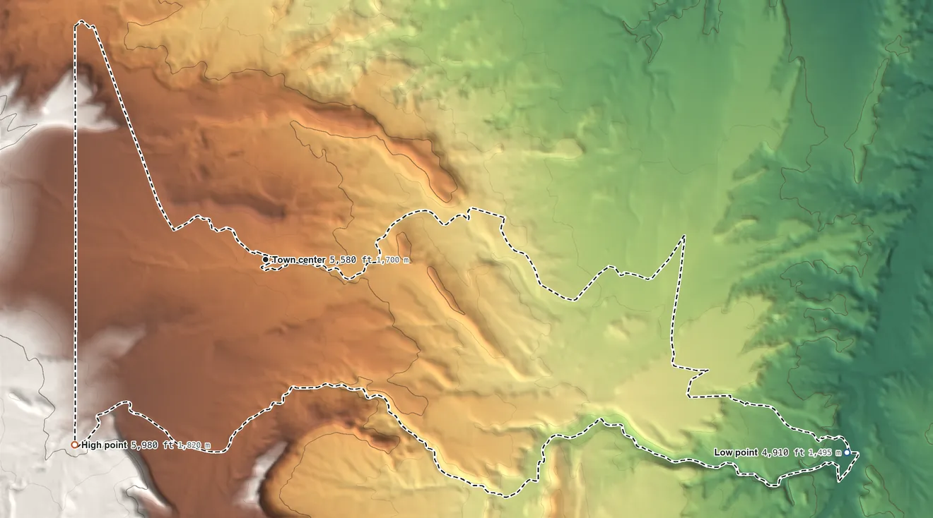 Topographic elevation map of Beclabito, New Mexico, shaded from 4,910 ft on the east side to 5,980 ft on the southwest edge, below higher ground just outside