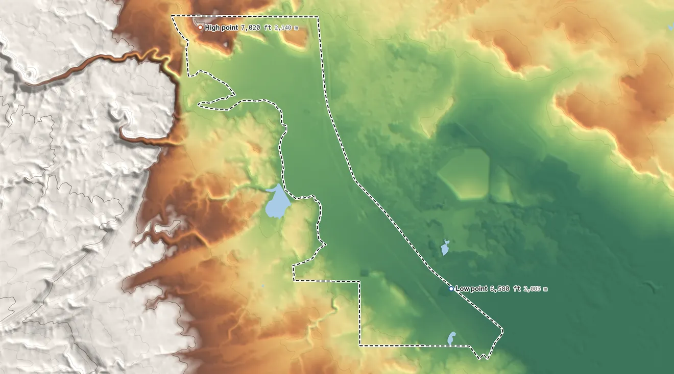 Topographic elevation map of Bluewater Village, New Mexico, shaded from 6,580 ft on the southeast side to 7,020 ft on the northwest side
