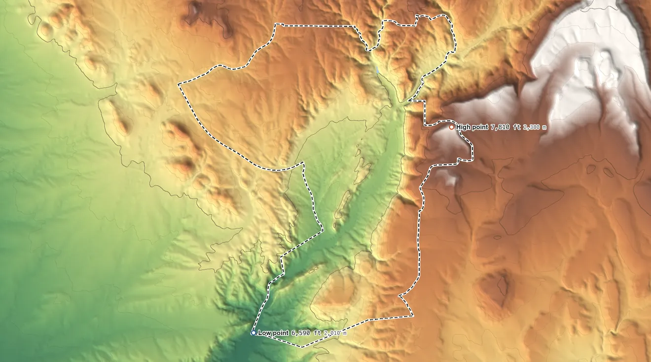 Topographic elevation map of Cañoncito, New Mexico, shaded from 6,590 ft on the south side to 7,810 ft on the east side