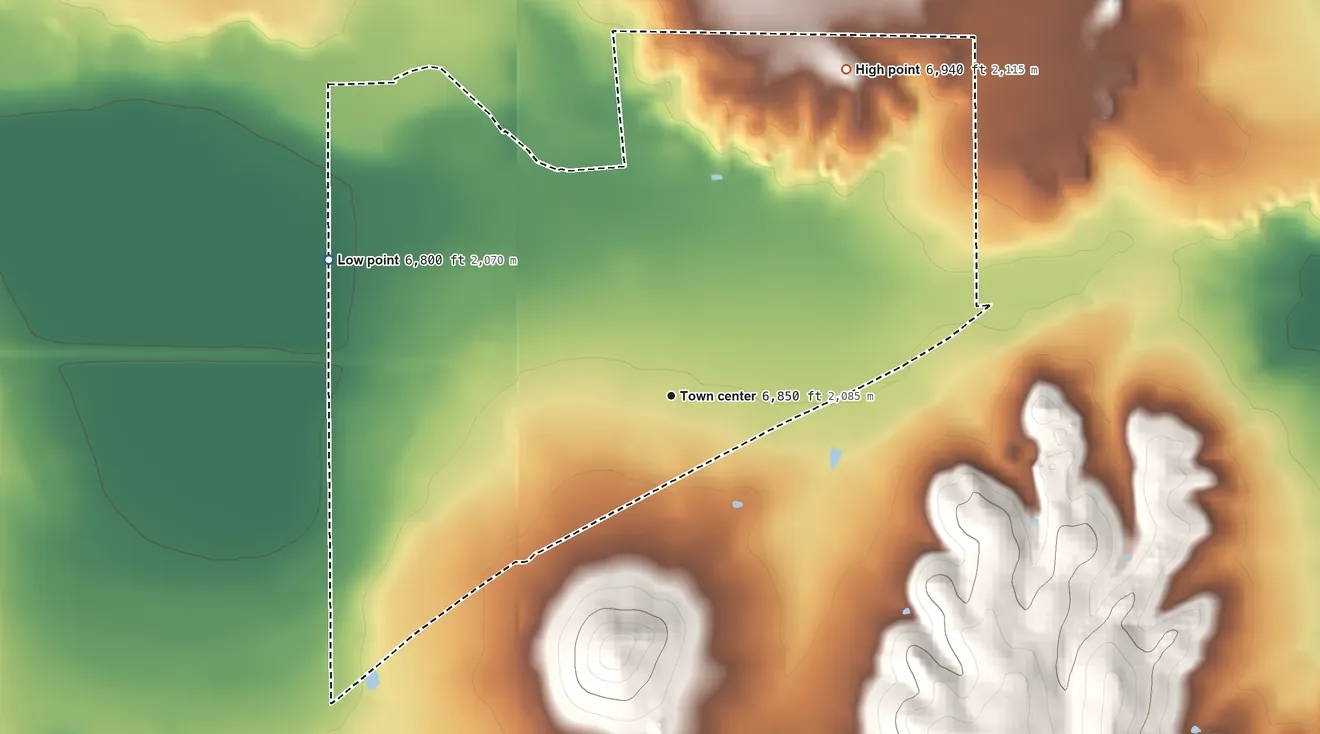Topographic elevation map of Capulin, New Mexico, shaded from 6,800 ft on the west side to 6,940 ft on the northeast edge, below higher ground just outside