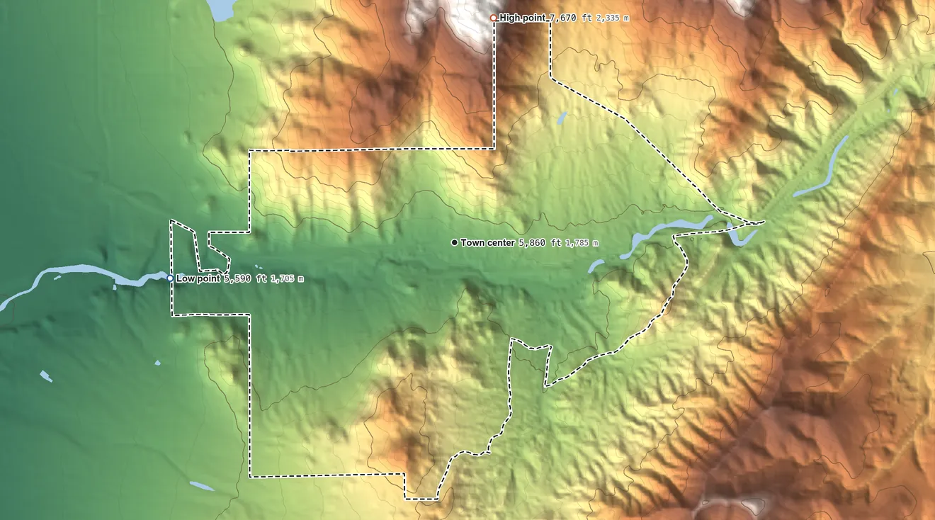 Topographic elevation map of Carnuel, New Mexico, shaded from 5,590 ft on the west side to 7,670 ft at the foot of the Sandia Mountains