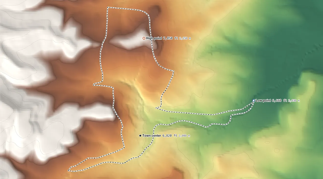 Topographic elevation map of Chilili, New Mexico, shaded from 6,660 ft on the east side to 7,050 ft on the north side