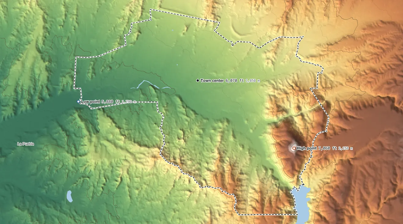 Topographic elevation map of Chimayo, New Mexico, shaded from 5,880 ft on the west side to 7,060 ft on the southeast side
