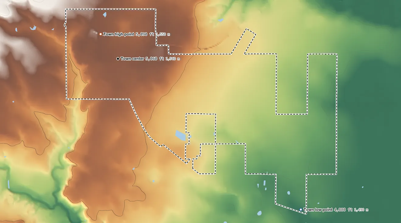 Topographic elevation map of Clayton, New Mexico, shaded from 4,880 ft on the southeast side to 5,090 ft near the middle