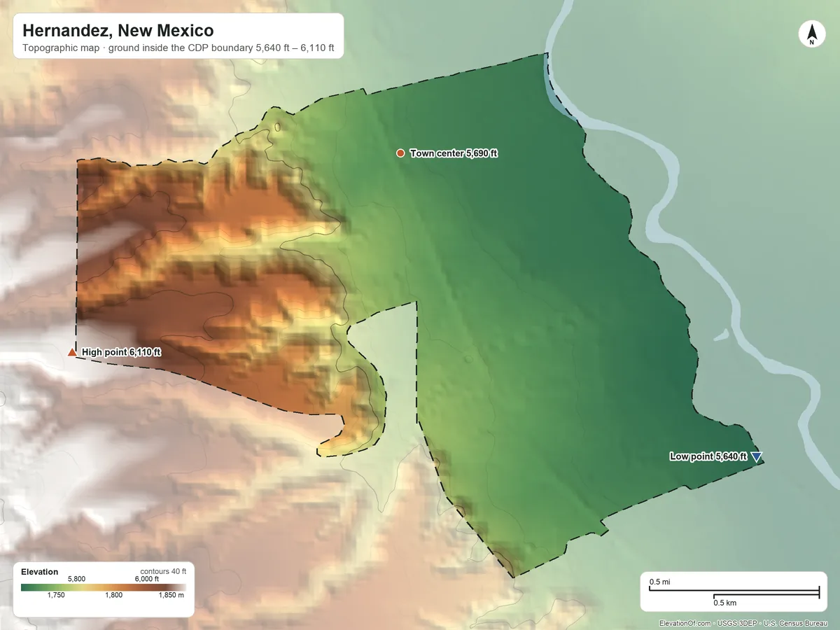Topographic elevation map of Hernandez, New Mexico, shaded from 5,640 ft on the southeast side to 6,110 ft on the southwest edge, below higher ground just outside