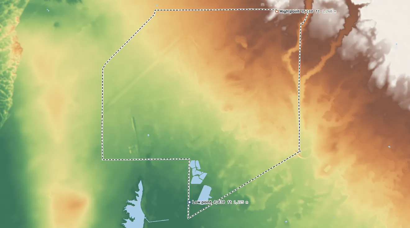 Topographic elevation map of Holloman AFB, New Mexico, shaded from 4,030 ft on the southwest side to 4,140 ft on the north side