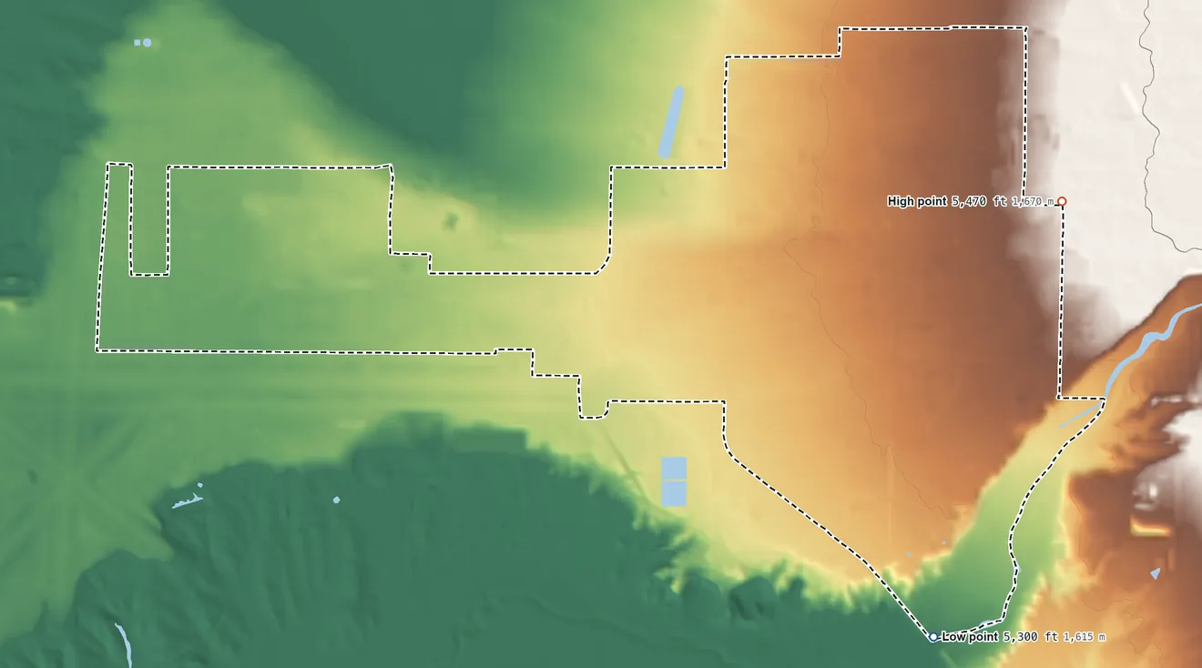 Topographic elevation map of Kirtland AFB, New Mexico, shaded from 5,300 ft on the south side to 5,470 ft on the east side